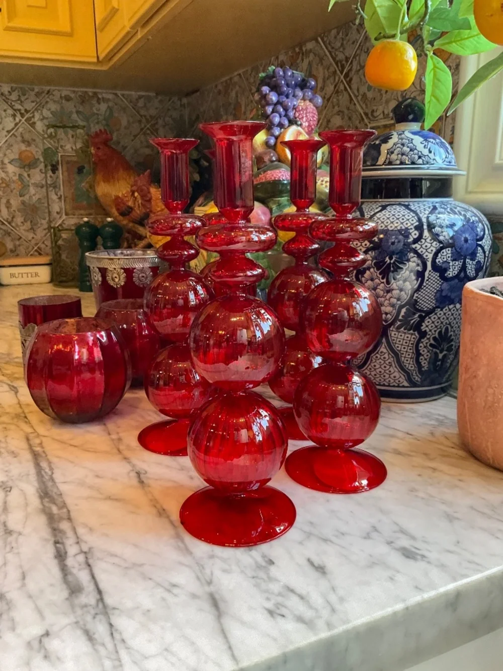 Set of lovely gathered red glass candlesticks, votive holders and vases